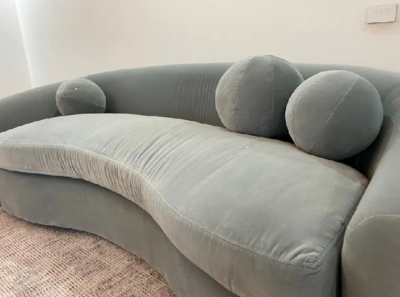 Grey sofa on beige rug